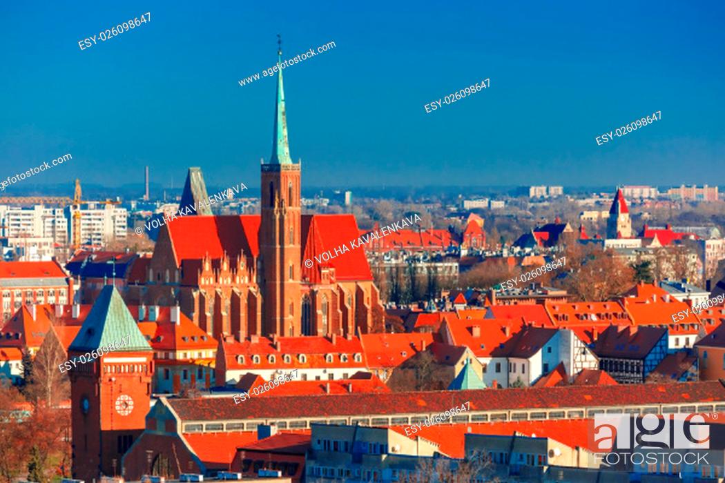Stock Photo: Aerial view of Ostrow Tumski with church of the Holy Cross and St. Bartholomew from St. Mary Magdalene Church in the morning in Wroclaw, Poland.