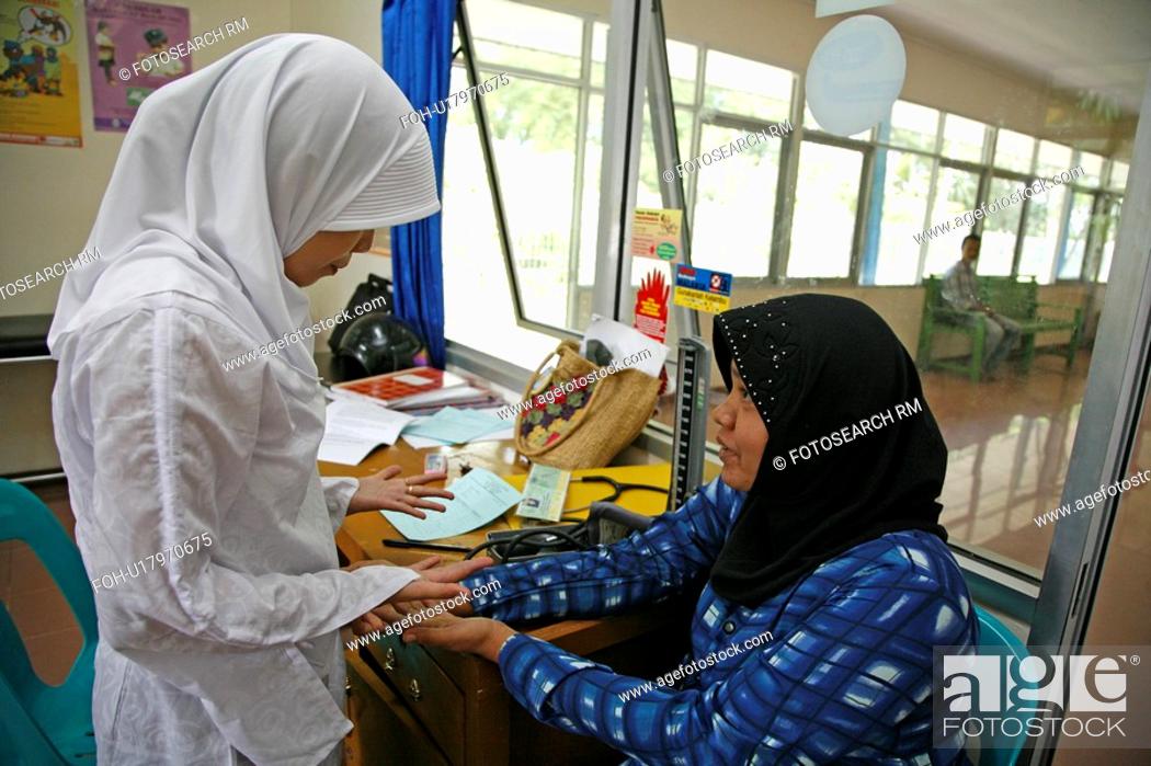 Stock Photo: woman women indonesia government health clinic.