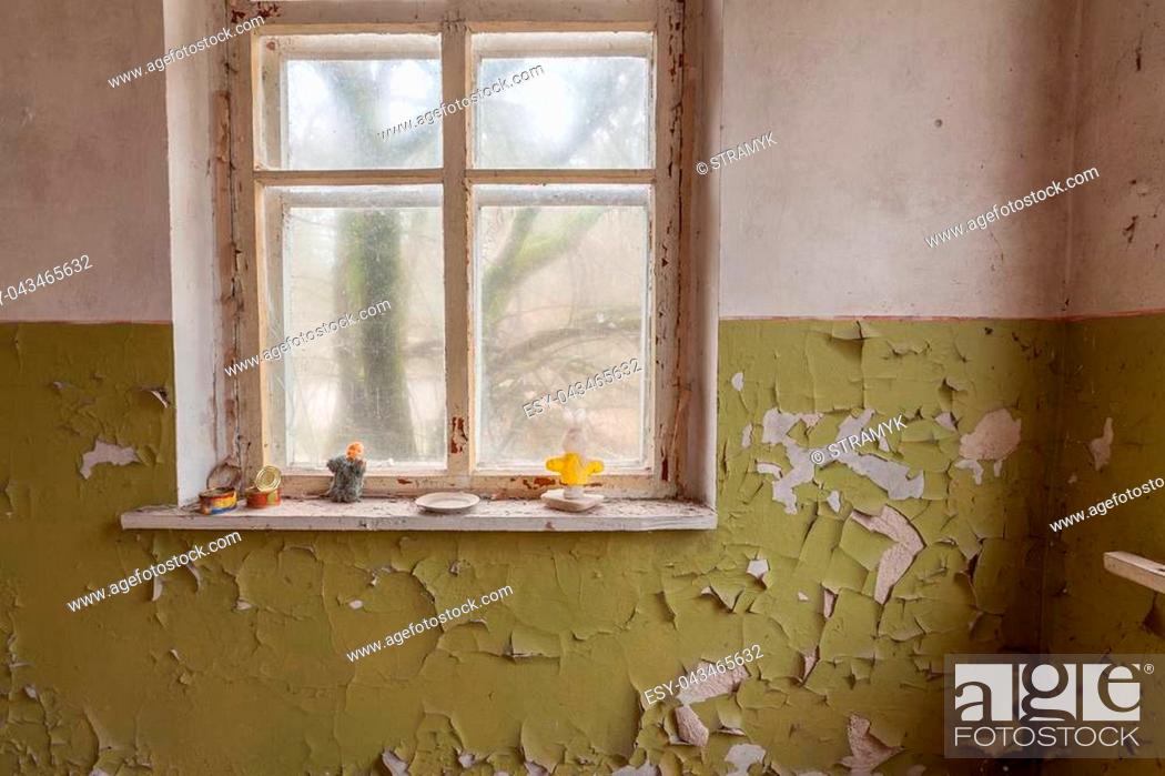 Stock Photo: Window in abandoned kindergarten with old cracky walls. Chernobyl, Ukraine.