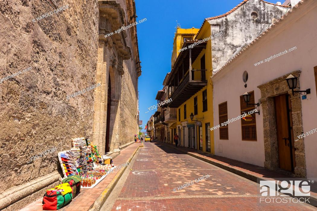 Stock Photo: Streets of colonial houses with handicrafts of street vendors in the ancient walled city of Cartagena de Indias. UNESCO's historical heritage of humanity.