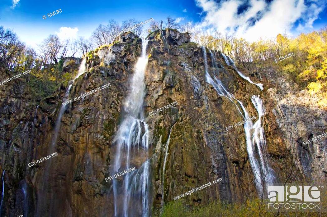 Stock Photo: Plitvice Lakes with a big waterfall under the blue sky, National Park in Croatia.