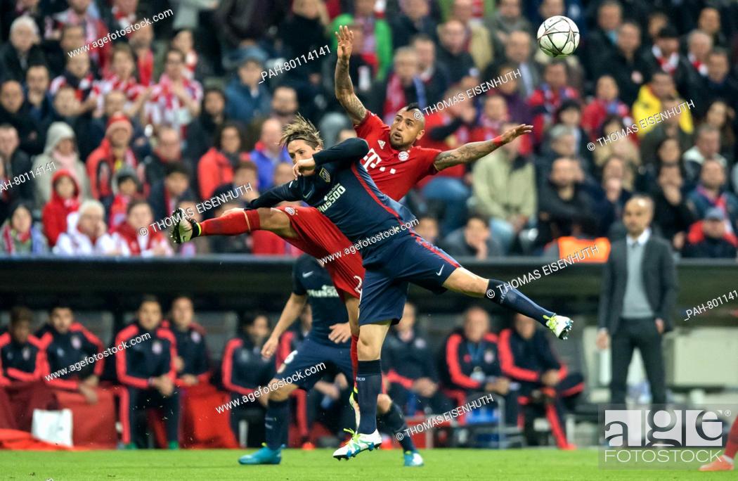 Stock Photo: Bayern Munich's Arturo Vidal (red) and Madrid's Fernando Torres in action during the UEFA Champions League semi final soccer match FC Bayern Munich vs Atletico.
