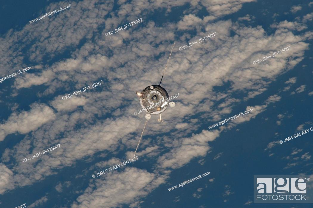 Stock Photo: An unpiloted ISS Progress 33 cargo craft approaches the International Space Station. On June 30, the Progress undocked from the station and was commanded into a.