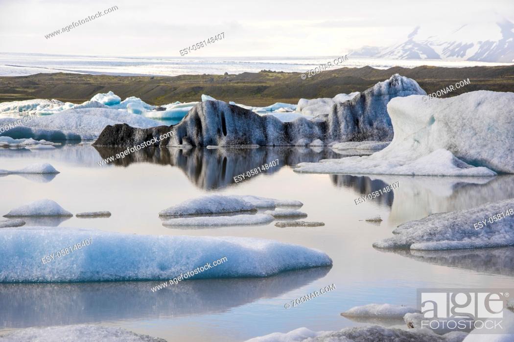 Stock Photo: Water reflections in Iceberg in Jokulsarlon glacier lake in Iceland. The icebergs originated from the Vatnajokull float. This location was used for various.