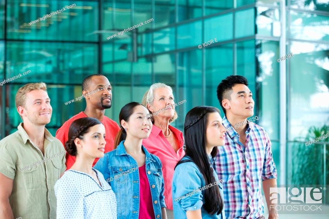 Stock Photo: Group of people looking up.
