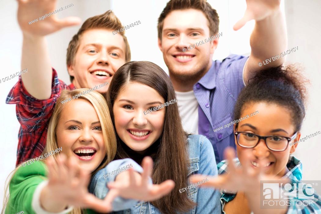 Stock Photo: education concept - group of students at school.