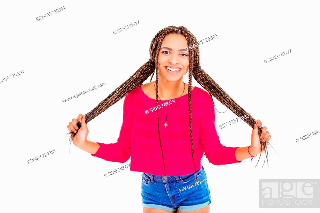 Funny picture of african young woman. Girl with African braids looking at  camera and cheerfully..., Stock Photo, Picture And Low Budget Royalty Free  Image. Pic. ESY-035729301 | agefotostock