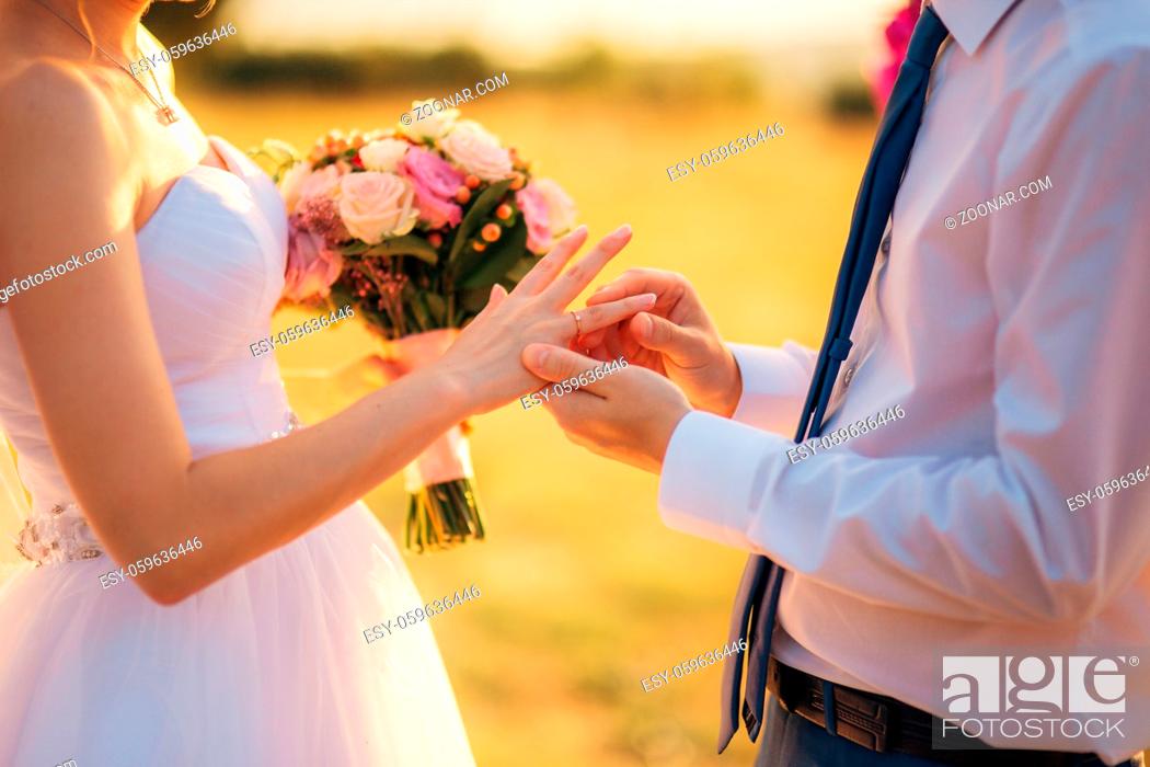 Stock Photo: The newlyweds exchange rings at a wedding in Montenegro.