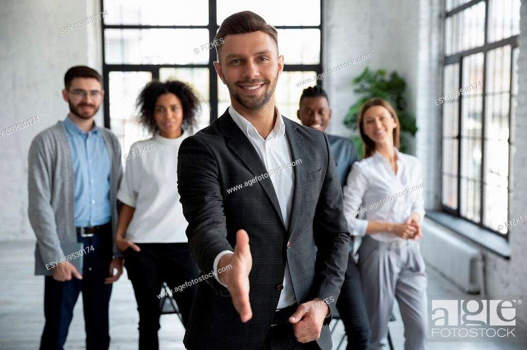 Stock Photo: Head shot portrait confident smiling businessman offering hand for handshake, looking at camera, friendly hr manager team leader welcoming new worker.