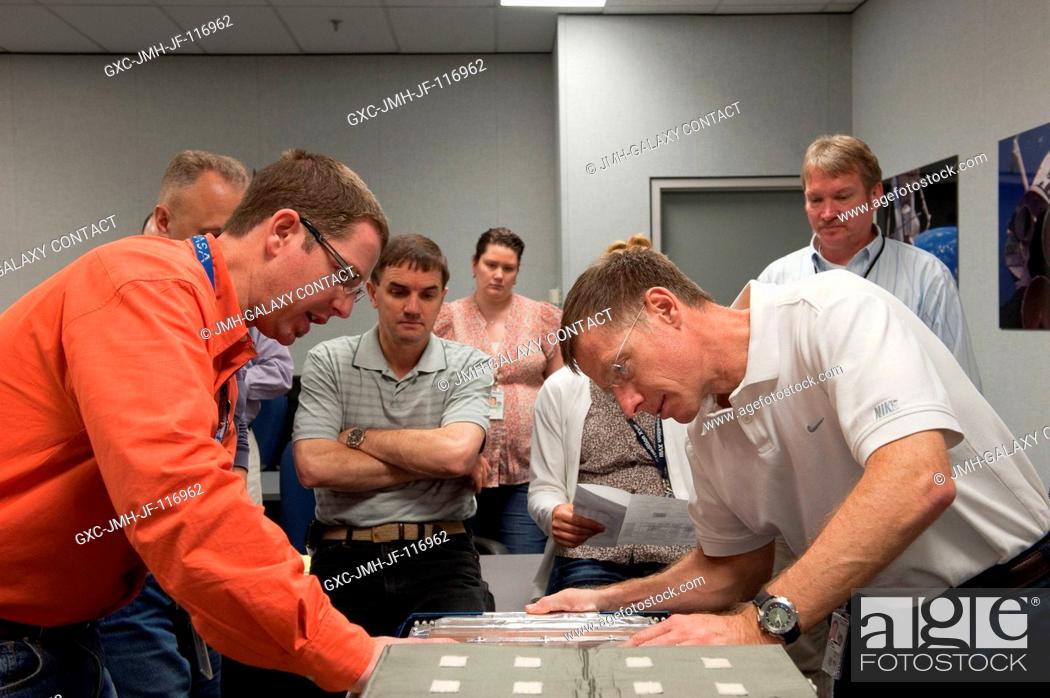 Stock Photo: STS-135 crew members participate in an Animal Enclosure Module (AEM) training session in the Jake Garn Simulation and Training Facility at NASA's Johnson Space.