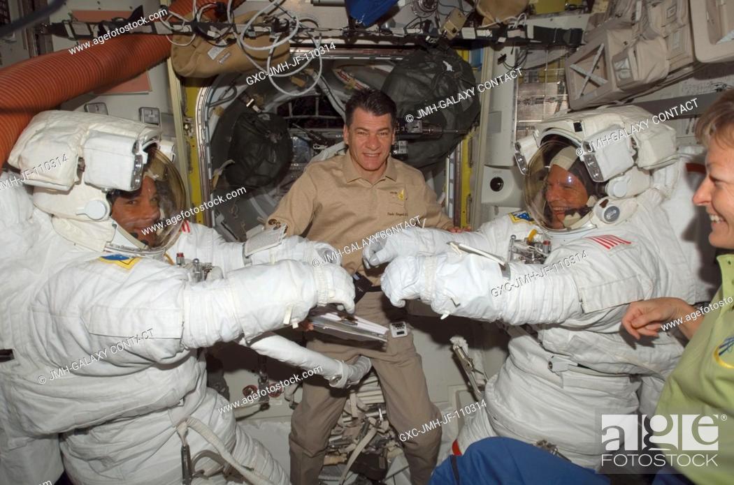 Stock Photo: Attired in their Extravehicular Mobility Unit (EMU) spacesuits, astronauts Doug Wheelock (left) and Scott Parazynski, STS-120 mission specialists.