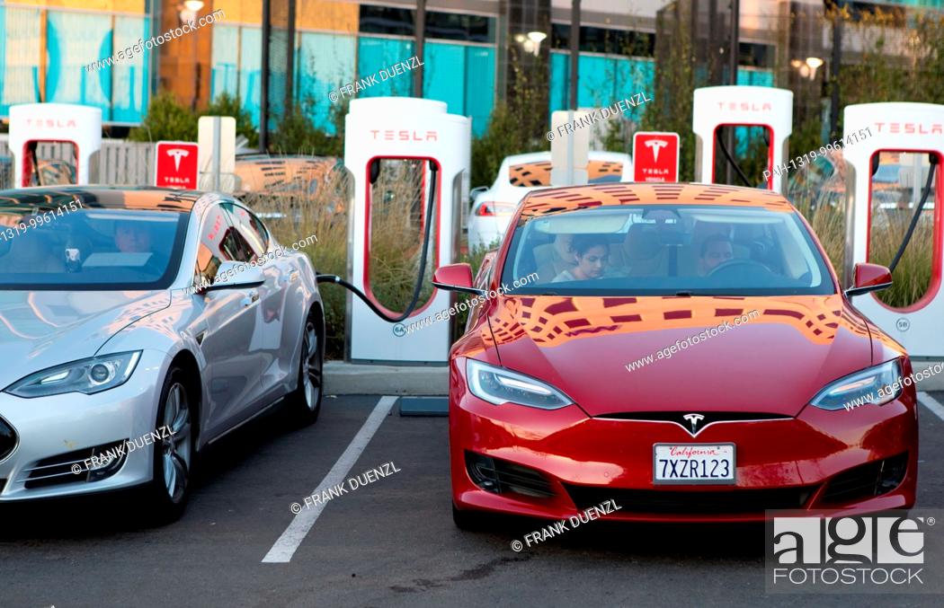 Stock Photo: Teslas charging at the Supercharger at the Qualcomm parking lot in Sorrento Valley, where many high tech, biotech, and IT companies are located, in Febuary 2018.