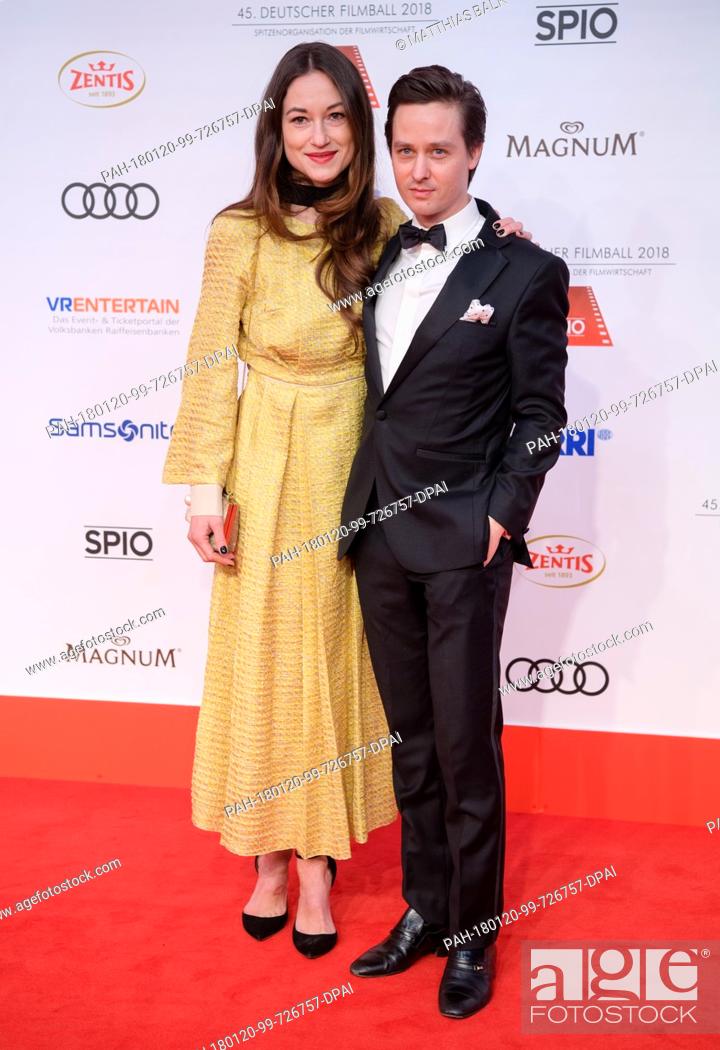 Stock Photo: Actor Tom Schilling and his girlfriend Annie Mosebach standing on the red carpet ahead of the 45th German Film Ball in the Bayerischer Hof in Munich, Germany.
