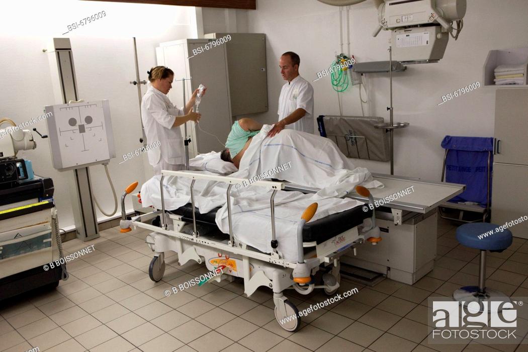 Stock Photo: Photo essay at the hospital of Meaux, France. Department of medical imagery. Operators with a patient.