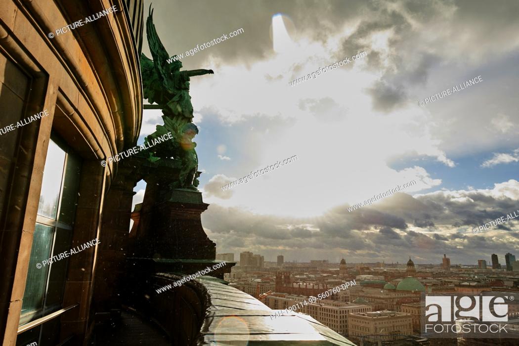 Stock Photo: 14 January 2019, Berlin: The view from the Berlin Cathedral in Berlin Mitte. The wet roofs of the capital reflect the sunlight.