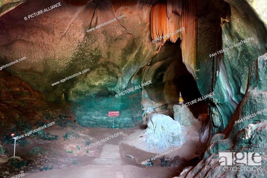 Stock Photo: 04 March 2019, Thailand, Takua Thung: Cave complex in Wat Suwan Kuha, also called Wat Tham (""cave temple""). It belongs to a Buddhist temple complex in the.