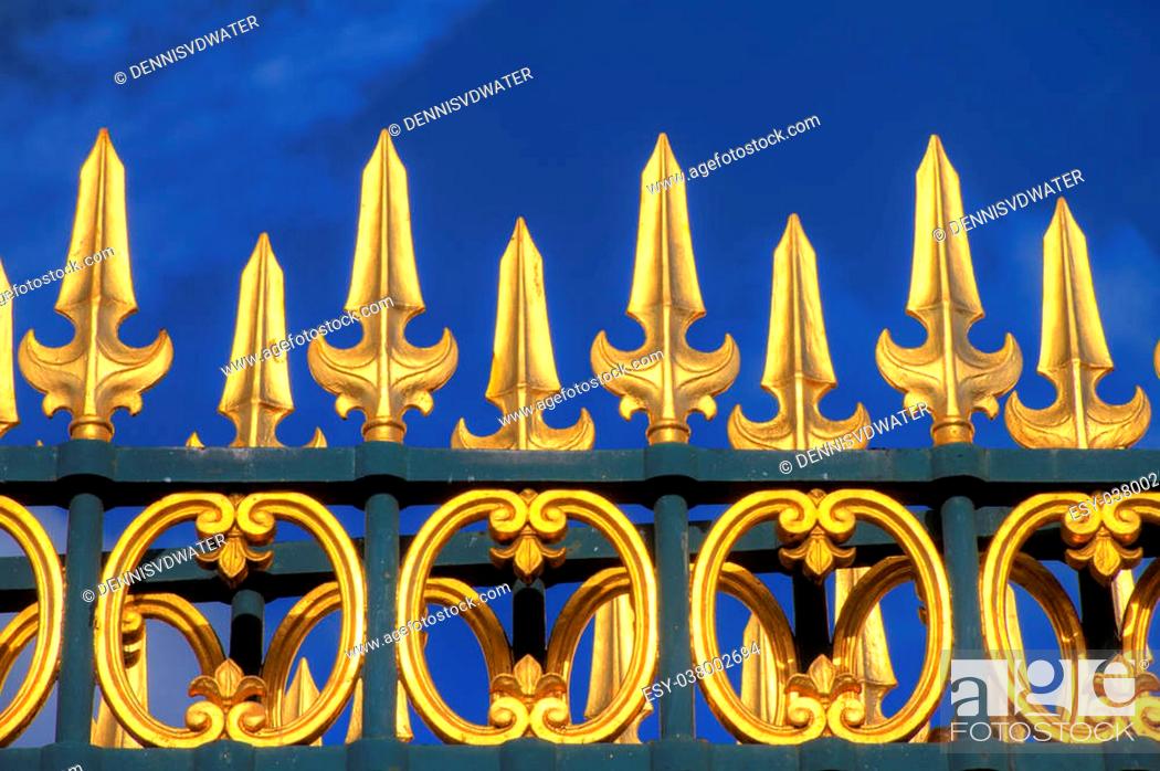 Stock Photo: Shiny golden gate in Paris, France.