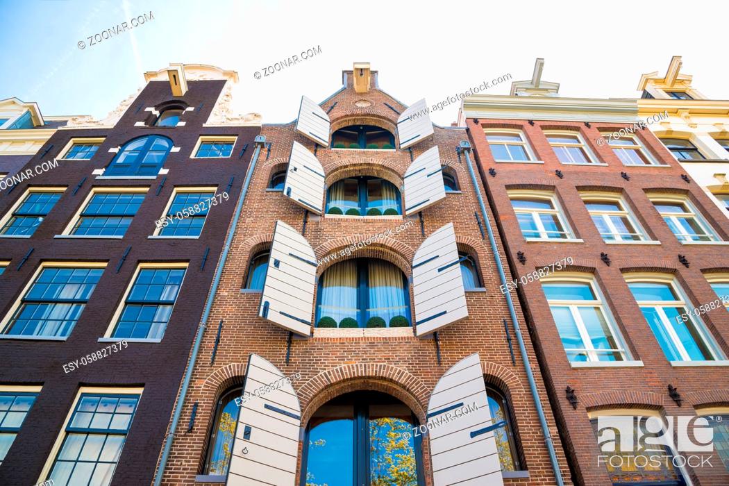 Stock Photo: Facade of traditional Amsterdam houses. Windows detail.