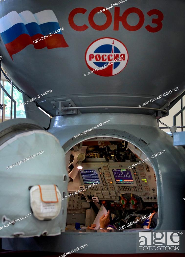 Stock Photo: Expedition 52 flight engineers Sergey Ryazanskiy of Roscosmos, Randy Bresnik of NASA, and Paolo Nespoli of ESA are in the Soyuz simulator for their final Soyuz.