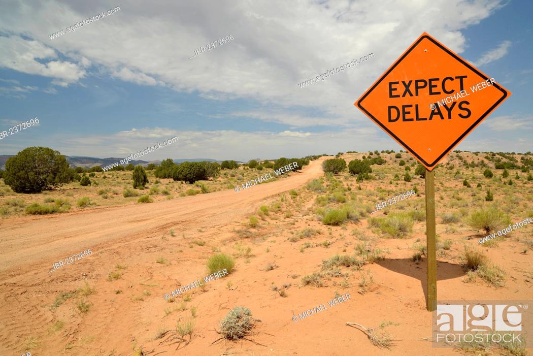 Stock Photo: Sign, lettering Expect delays, dirt road, Notom-Bullfrog Road, Capitol Reef National Park, Utah, USA.