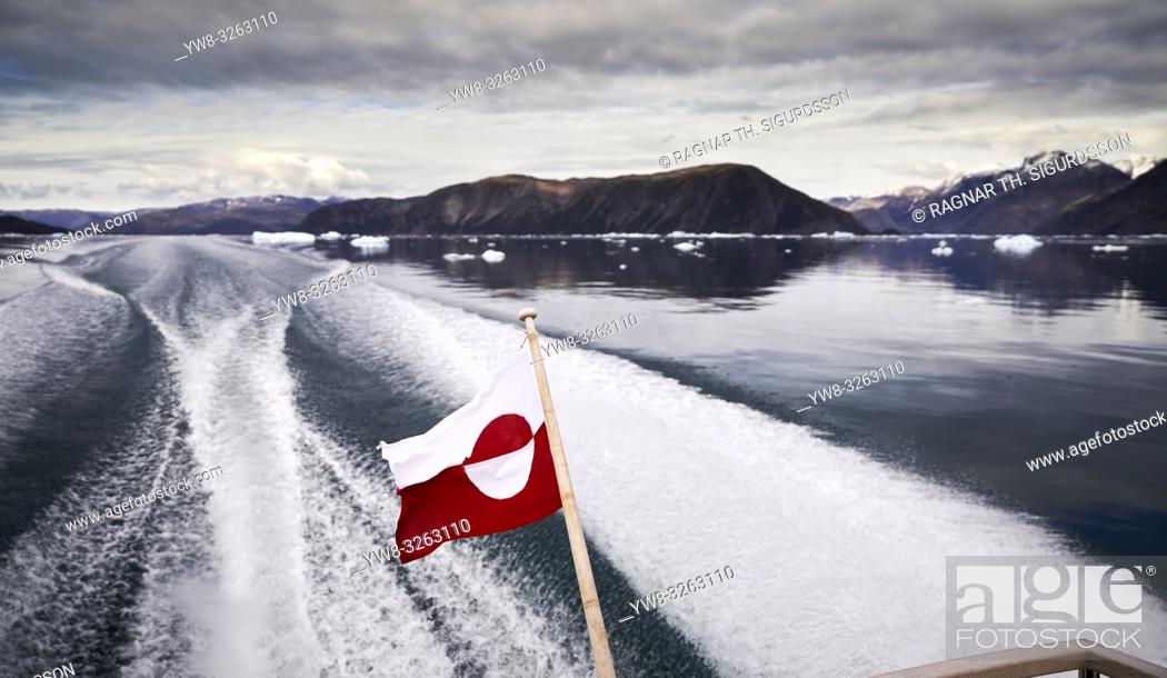 Stock Photo: Greenlandic Flag, and wake on Eiriksfjordur, South Greenland.