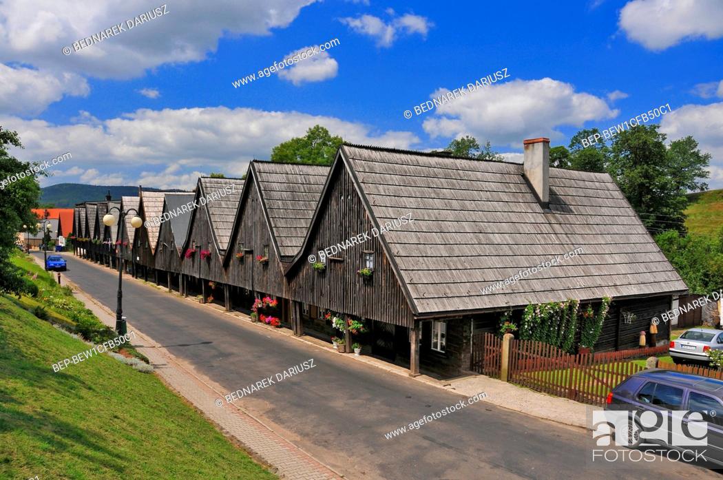 Stock Photo: 'Twelve Apostles' - houses weavers in village Chelmno Slaskie, Lower Silesian voivodeship, Poland. A group of wooden houses on the Sudecka street called 'Twelve.