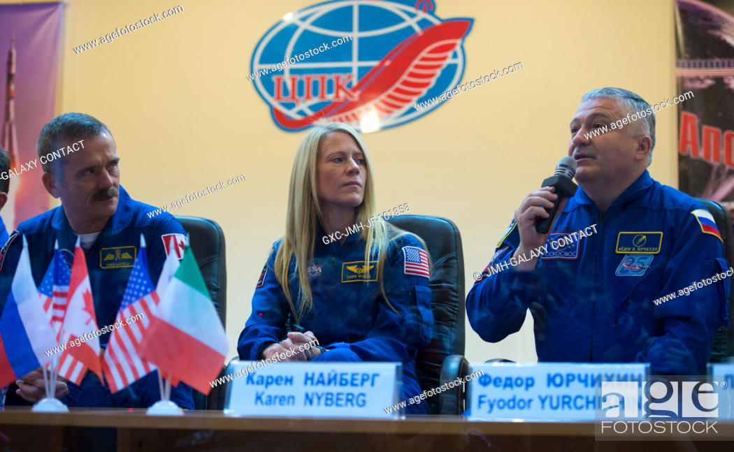 Stock Photo: Russian backup crew member Fyodor Yurchikhin, right, answers a reporter's question at a press conference held at the Cosmonaut Hotel on Dec.