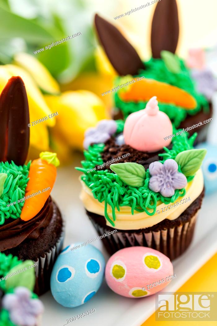 Stock Photo: Easter chocolate cupcakes decorated with piggy and bunny ears.