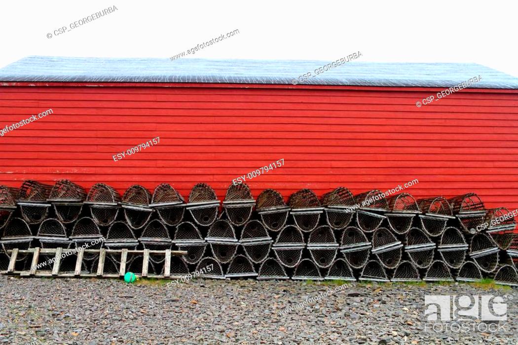 Stock Photo: Lobster traps and red shed.