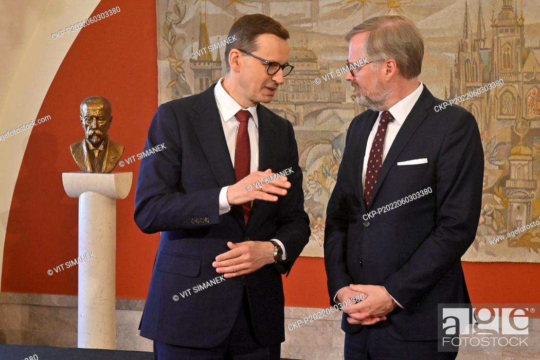 Stock Photo: Polish Prime Minister Mateusz Morawiecki (left) talks with his Czech counterpart Petr Fiala prior to joint meeting of Czech and Polish governments in.