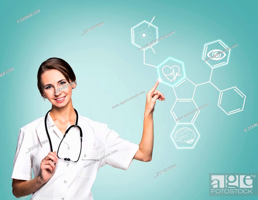 Stock Photo: Young female doctor in uniform touch hexagon with icons over gray background.