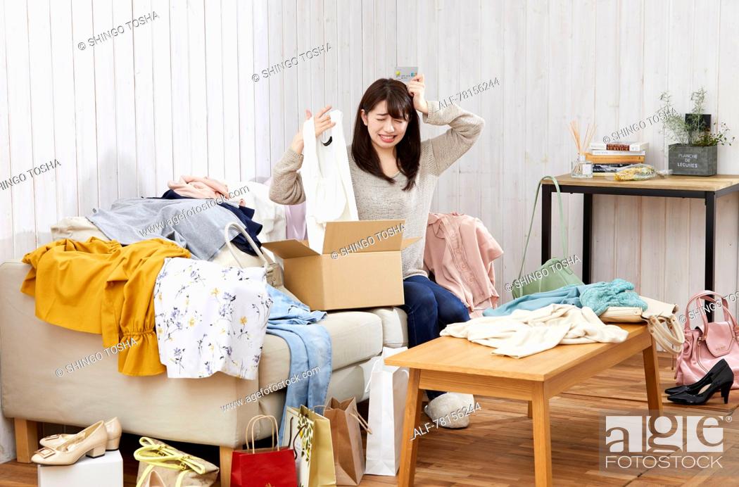 Stock Photo: Japanese woman buying online.