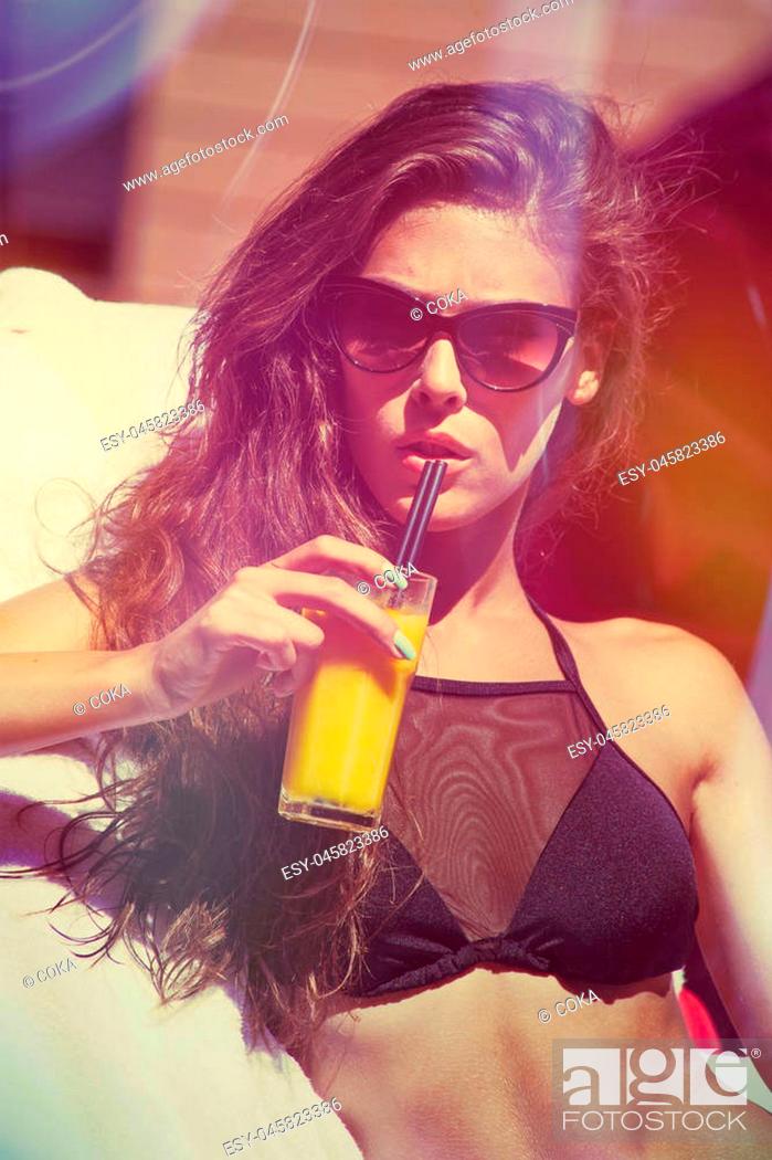 Stock Photo: attractive girl in bikini and sunglasses enjoy in sun and juice summer day at pool.