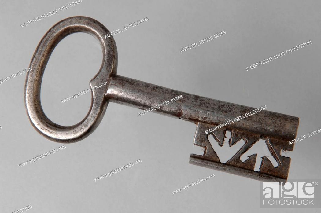 Stock Photo: Iron key with heart-shaped eye, hollow key handle and cruciform beards in beard, key iron iron, hand forged Key with heart-shaped eye (handle) hollow key handle.
