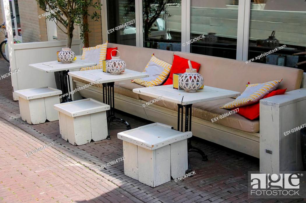 Stock Photo: Soft sofas with colorfull pillows in the street cafe terrace. Zandvoort, the Netherlands.