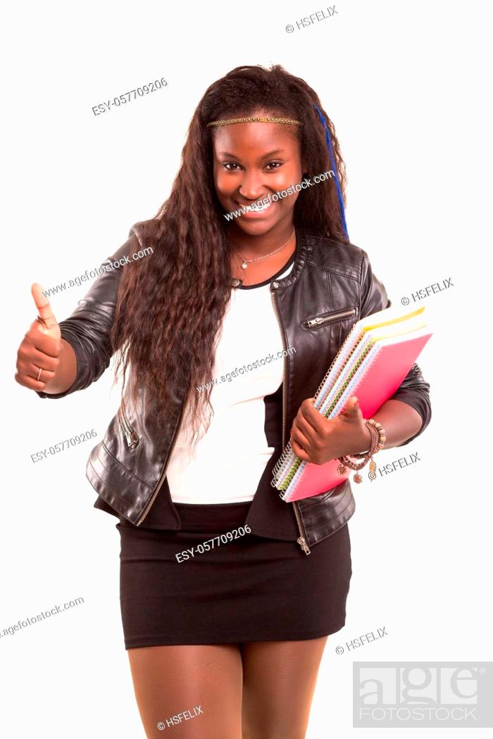 Stock Photo: Beautiful african student woman posing isolated over white background.
