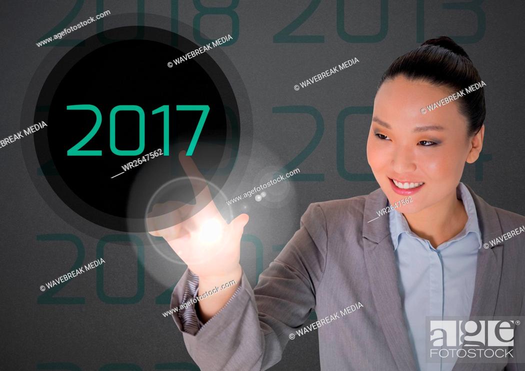 Stock Photo: Business woman in digitally generated background touching 2017.
