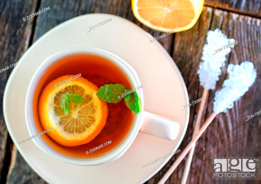 Stock Photo: fresh tea with mint and lemon in cup.