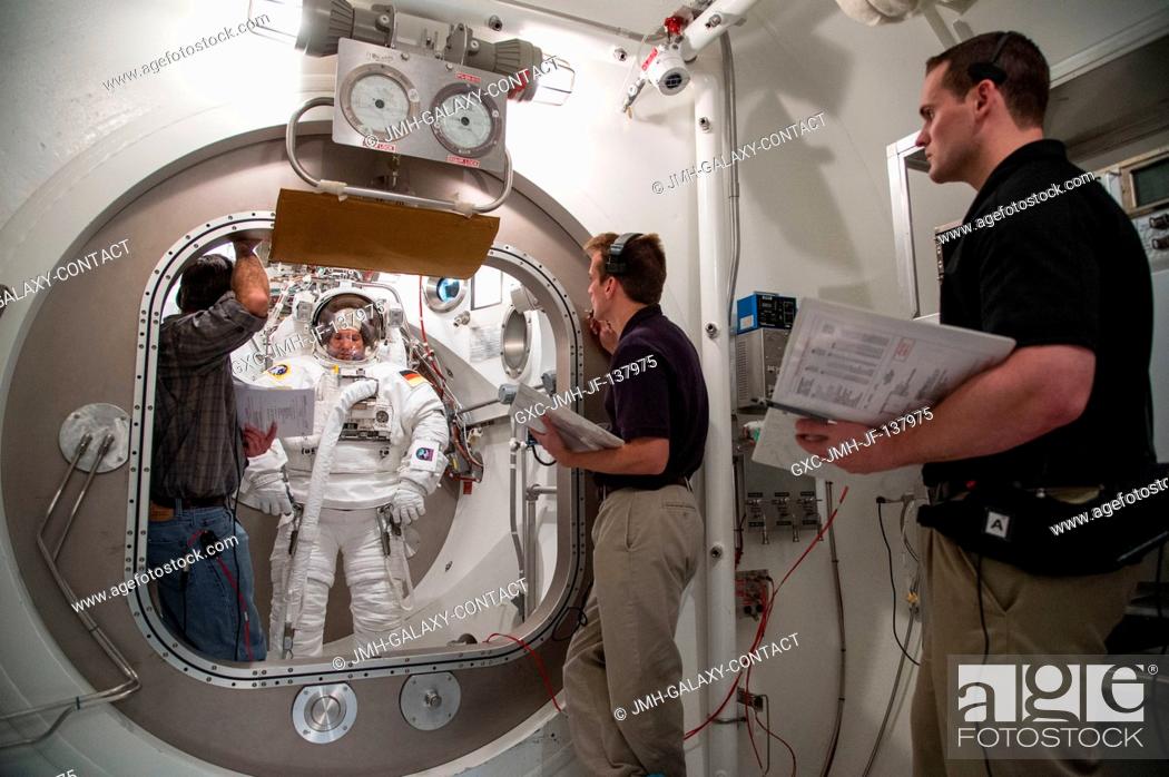 Stock Photo: European Space Agency astronaut Alexander Gerst, Expedition 4041 flight engineer, participates in an Extravehicular Mobility Unit (EMU) spacesuit fit check in.