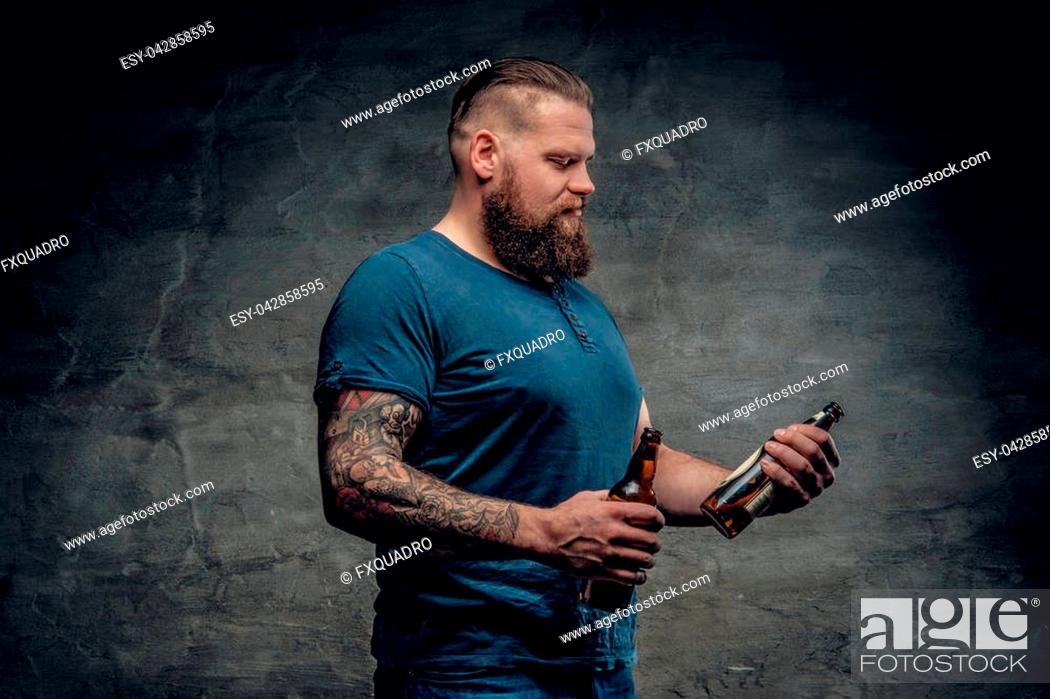 Fat bearded men with tattoos on arm holds beer bottle, Stock Photo, Picture  And Low Budget Royalty Free Image. Pic. ESY-042858595 | agefotostock