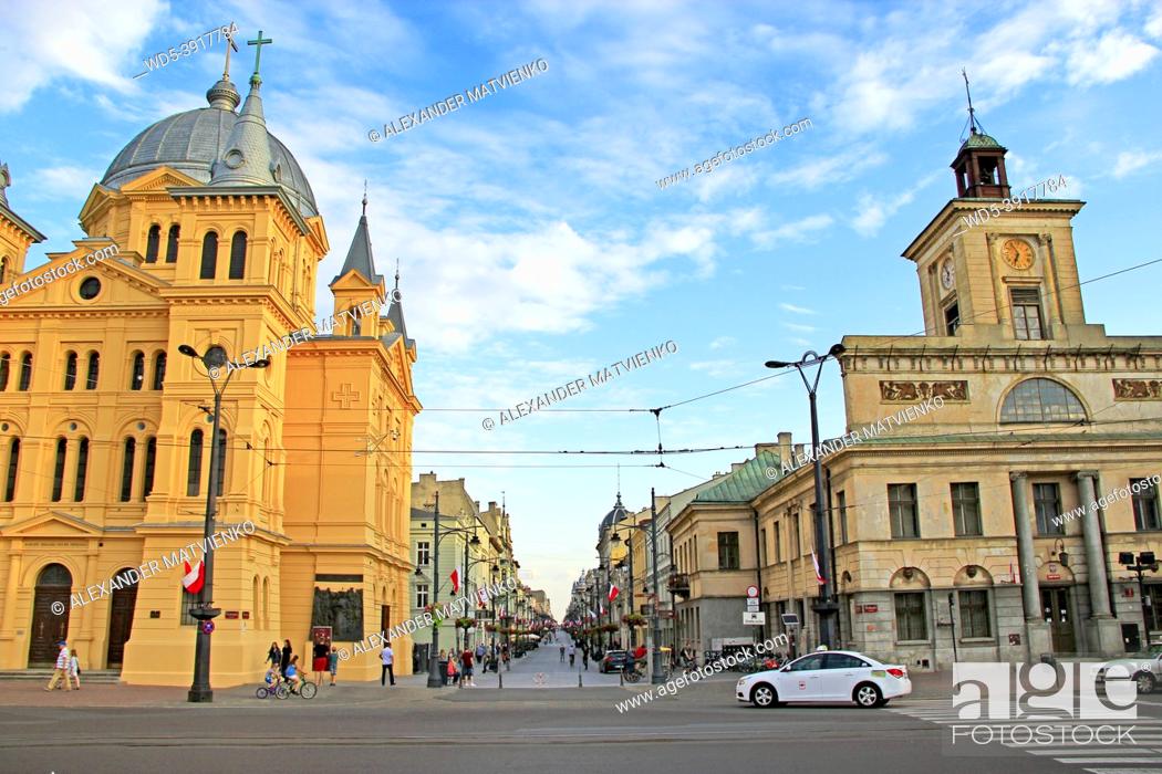 Stock Photo: Central street of Lodz. People walking along city street. The Descent of the Holy Spirit Church in Lodz, Poland. Central street of Lodz Piotrkowska in the.