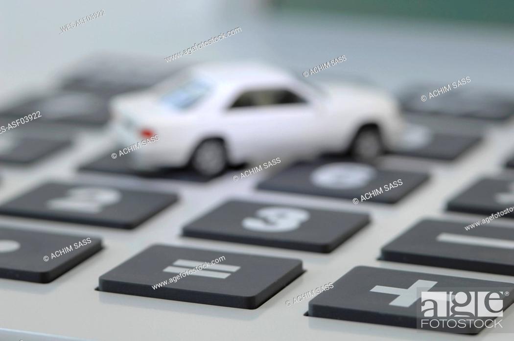 Stock Photo: Toy car on calculator.