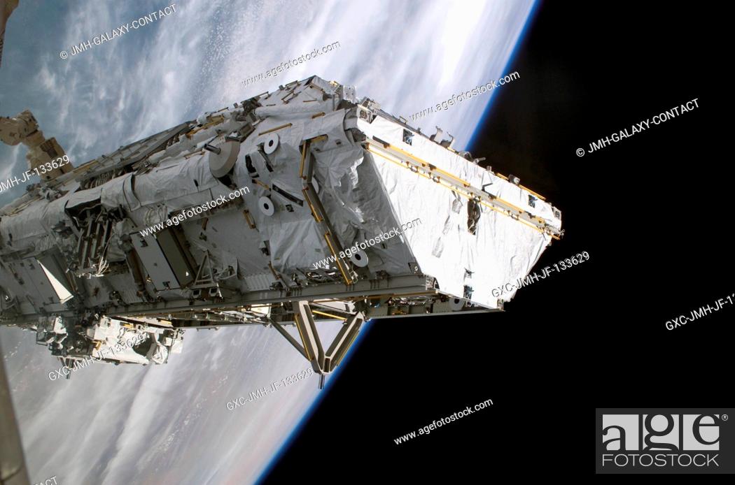 Stock Photo: Backdropped by the blackness of space and Earth's horizon, the S0 (S-Zero) Truss is moved from the Space Shuttle Atlantis' cargo bay.