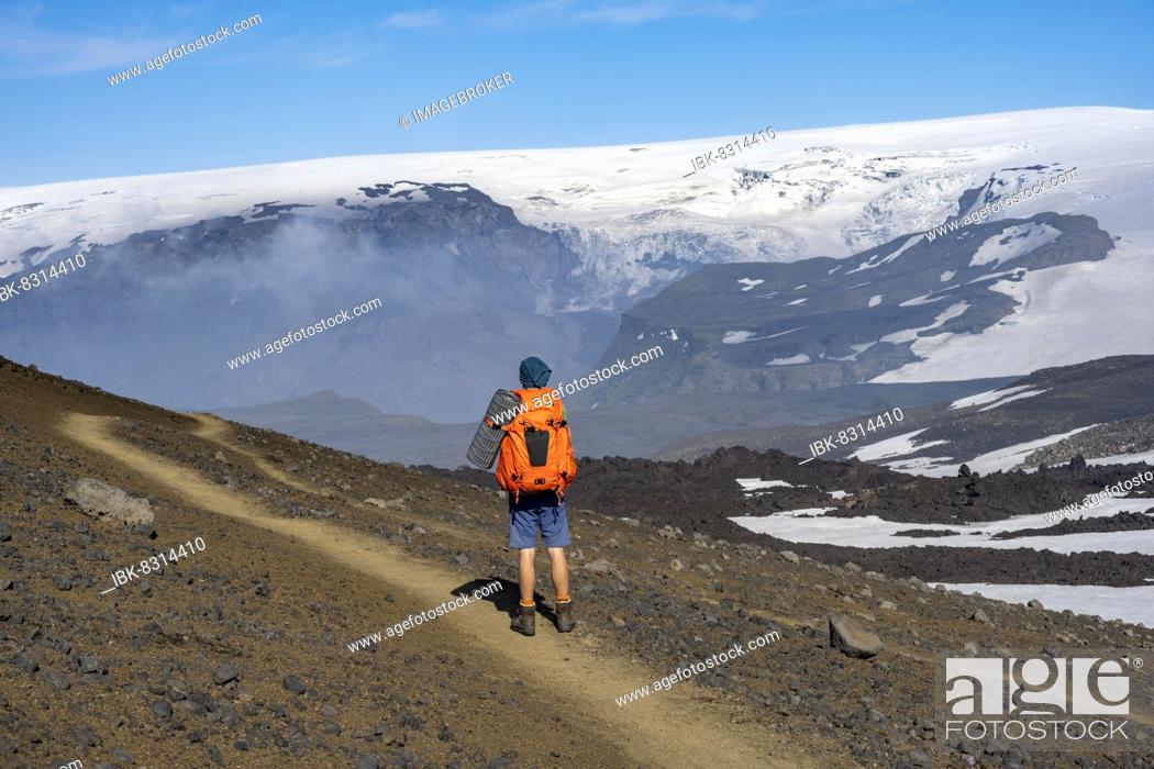 Stock Photo: Hikers on trail through volcanic landscape, Myrdalsjökull glacier in the back, Fimmvörðuháls hiking trail, Þórsmörk Nature Reserve, Suðurland, Iceland, Europe.