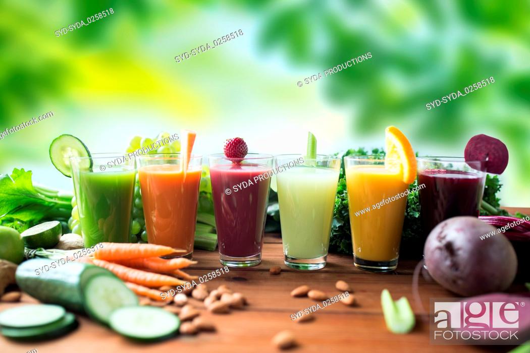 Stock Photo: glasses with different fruit or vegetable juices.