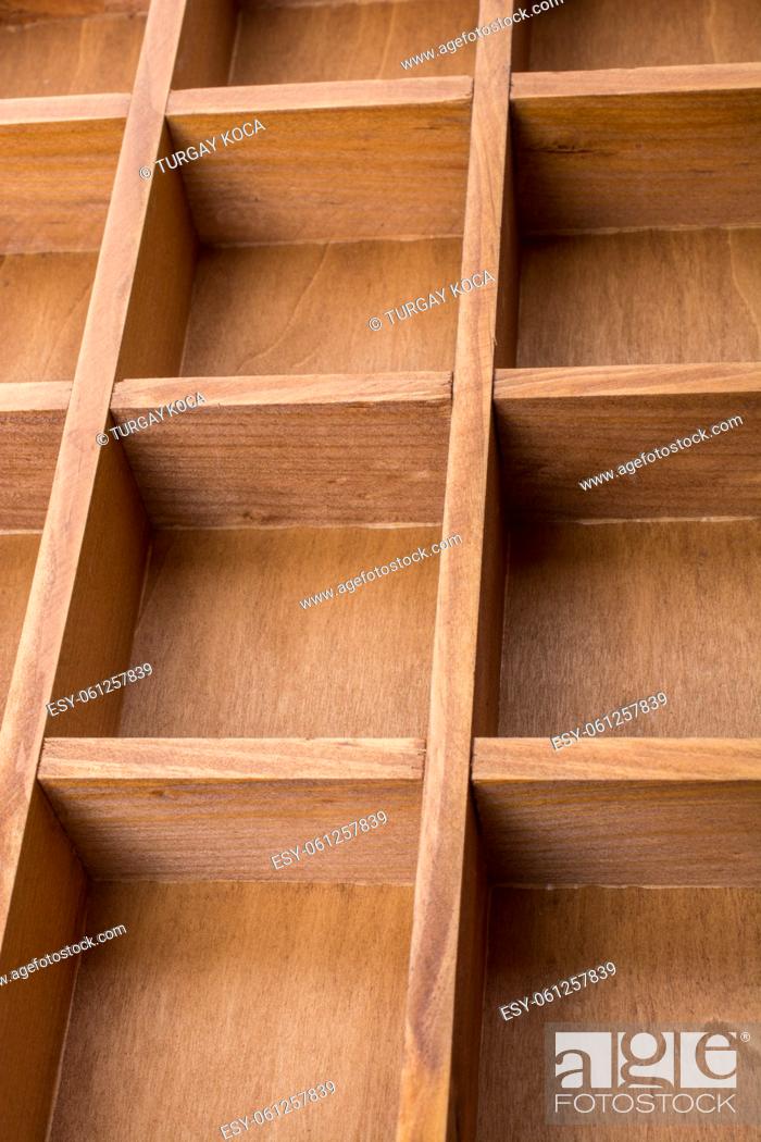 Stock Photo: Close up of a wooden box with compartments.