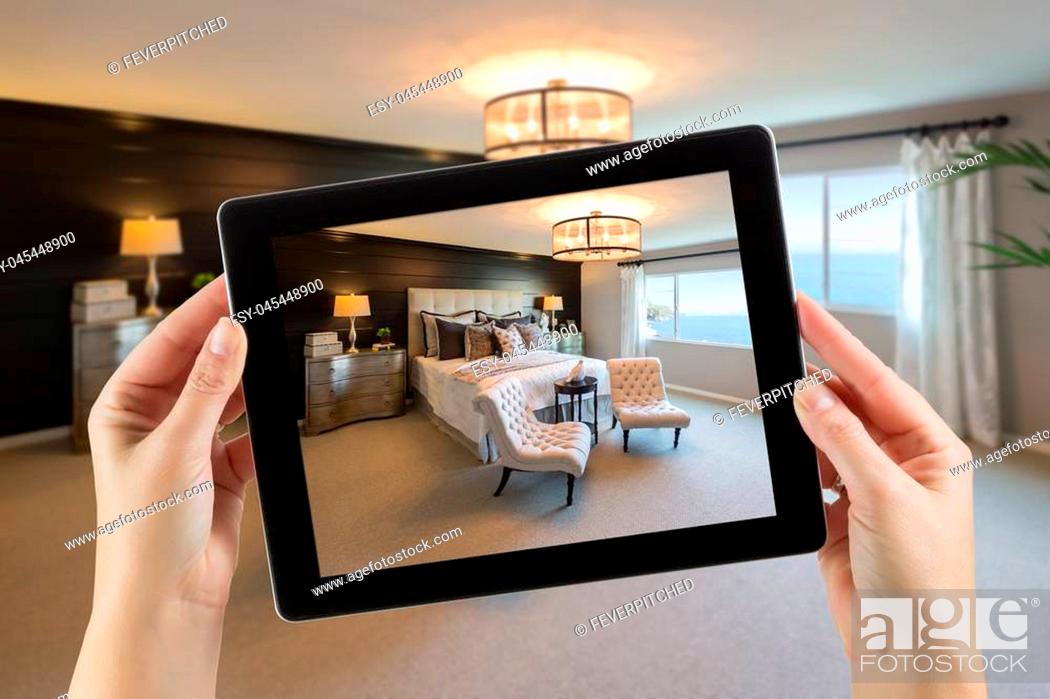 Stock Photo: Female Hands Holding Computer Tablet In Room with Photo on Screen.