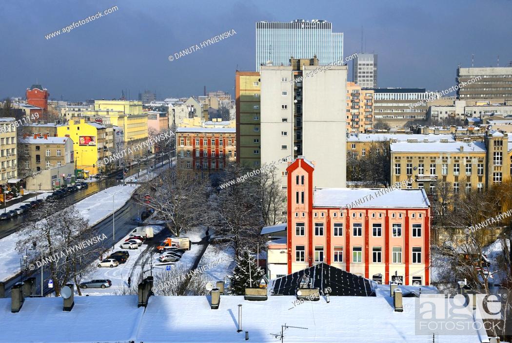 Stock Photo: Panoramic view of city center of Lodz, in front historic tenement buidings, on left Kosciuszki Avenue, pink-red building in front is a part of former factory of.