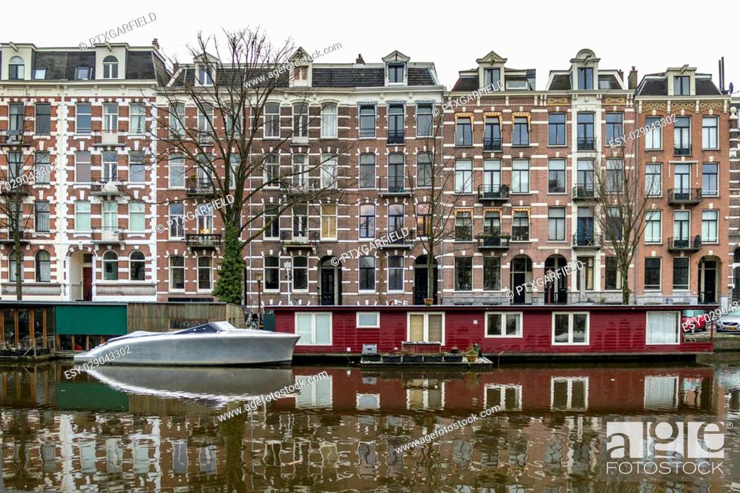 Stock Photo: Early morning winter view on one of the Unesco world heritage city canals (Singelgracht and Leidsegracht) of Amsterdam, The Netherlands.