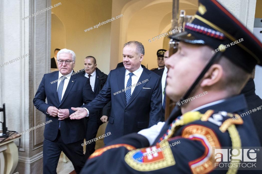 Stock Photo: HANDOUT - Handout picture made available on 17 November 2017 showing German President Frank-Walter Steinmeier (L) being received with military honours by Andrej.